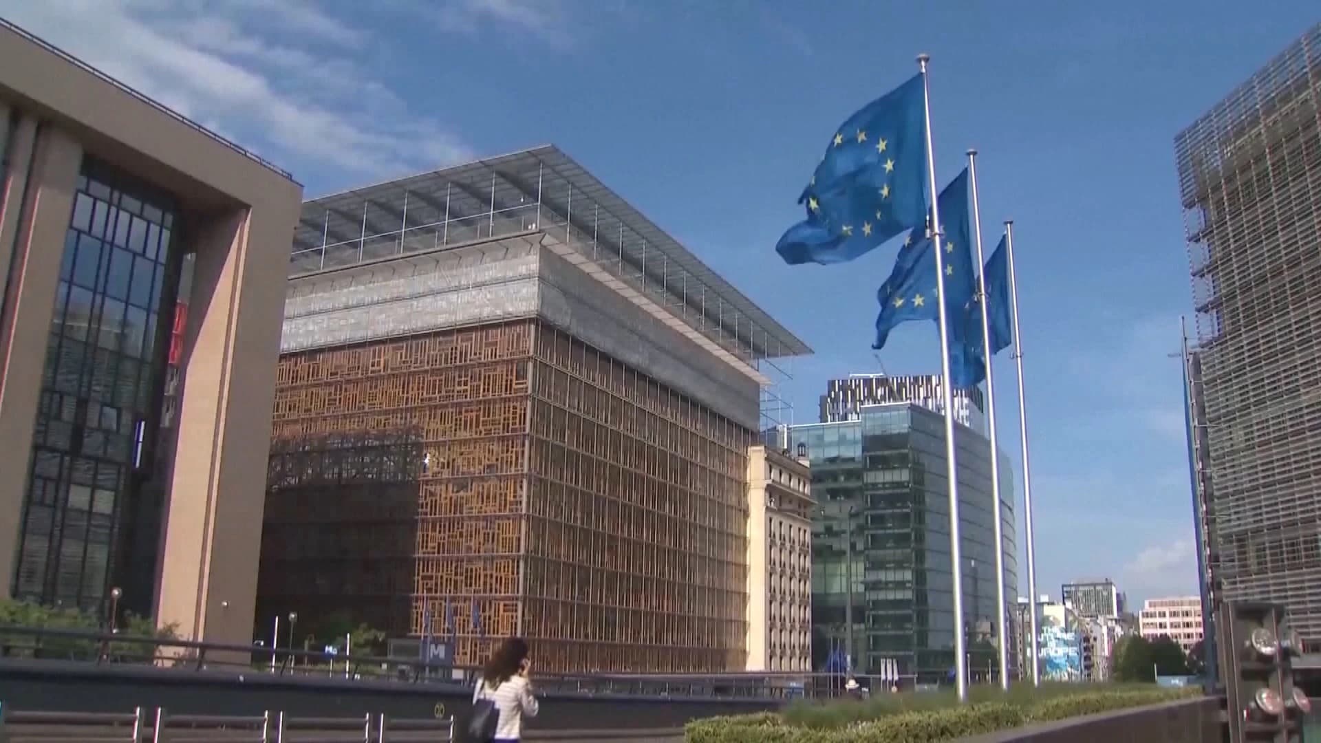 The European Council building in Brussels with EU flags flying in front of it