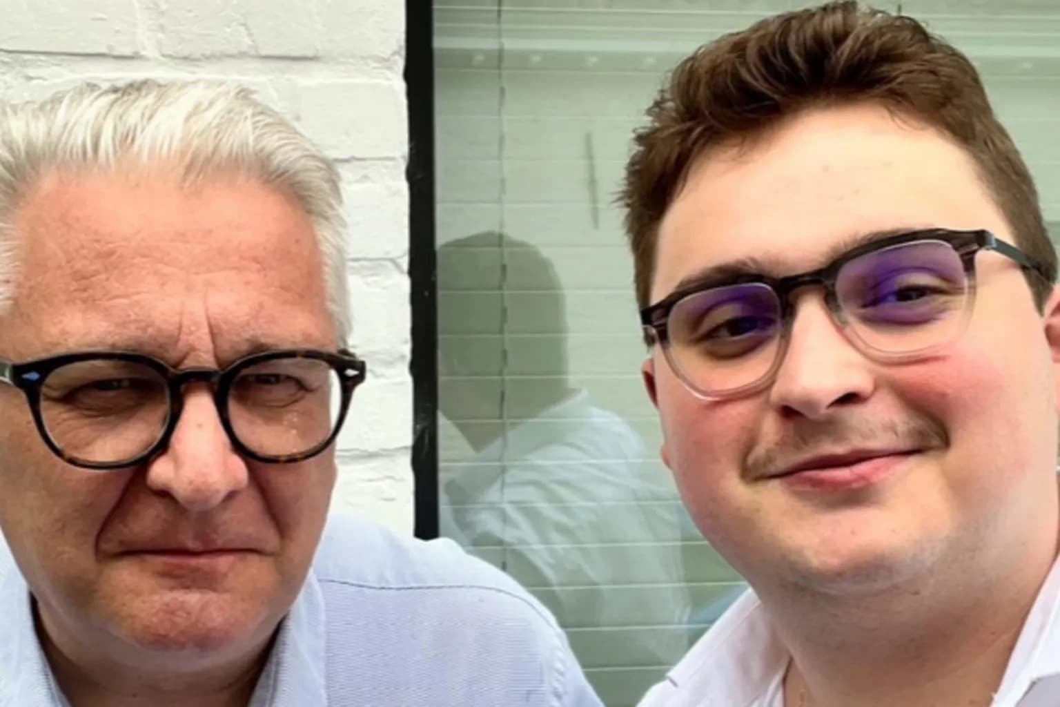 Prince Laurent and his son Clement Vandenkerckhove posing together, both wearing glasses